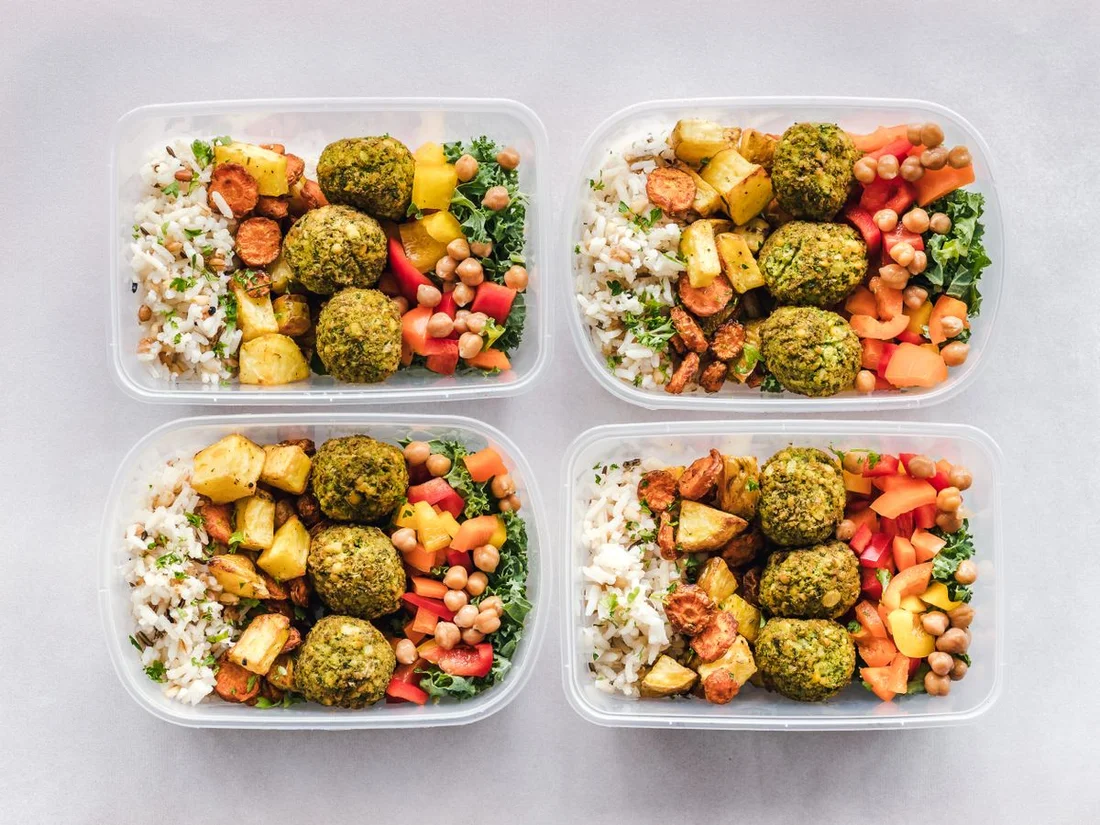 Example of prepared meals packed with rice, vegetables and falafel; not a CookUnity product photo